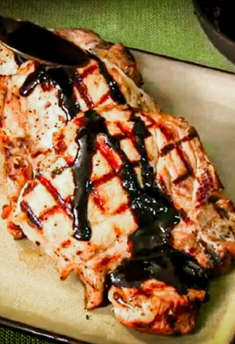 This Grilled Stuffed Pork Chops Recipe is topped with a balsamic glaze.