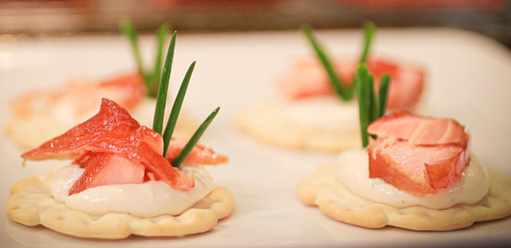 honey smoked salmon appetizer on crackers with cream cheese