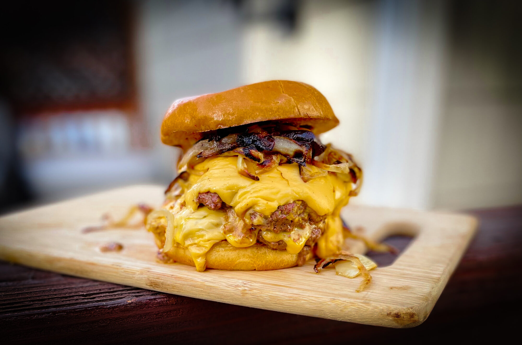 Photo of the Best Smashburger Recipe - double patties with melted American cheese and grilled onions.