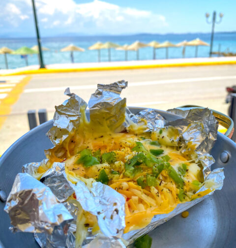 Photo of a baked feta dip recipe at the beach in Corfu, Greece